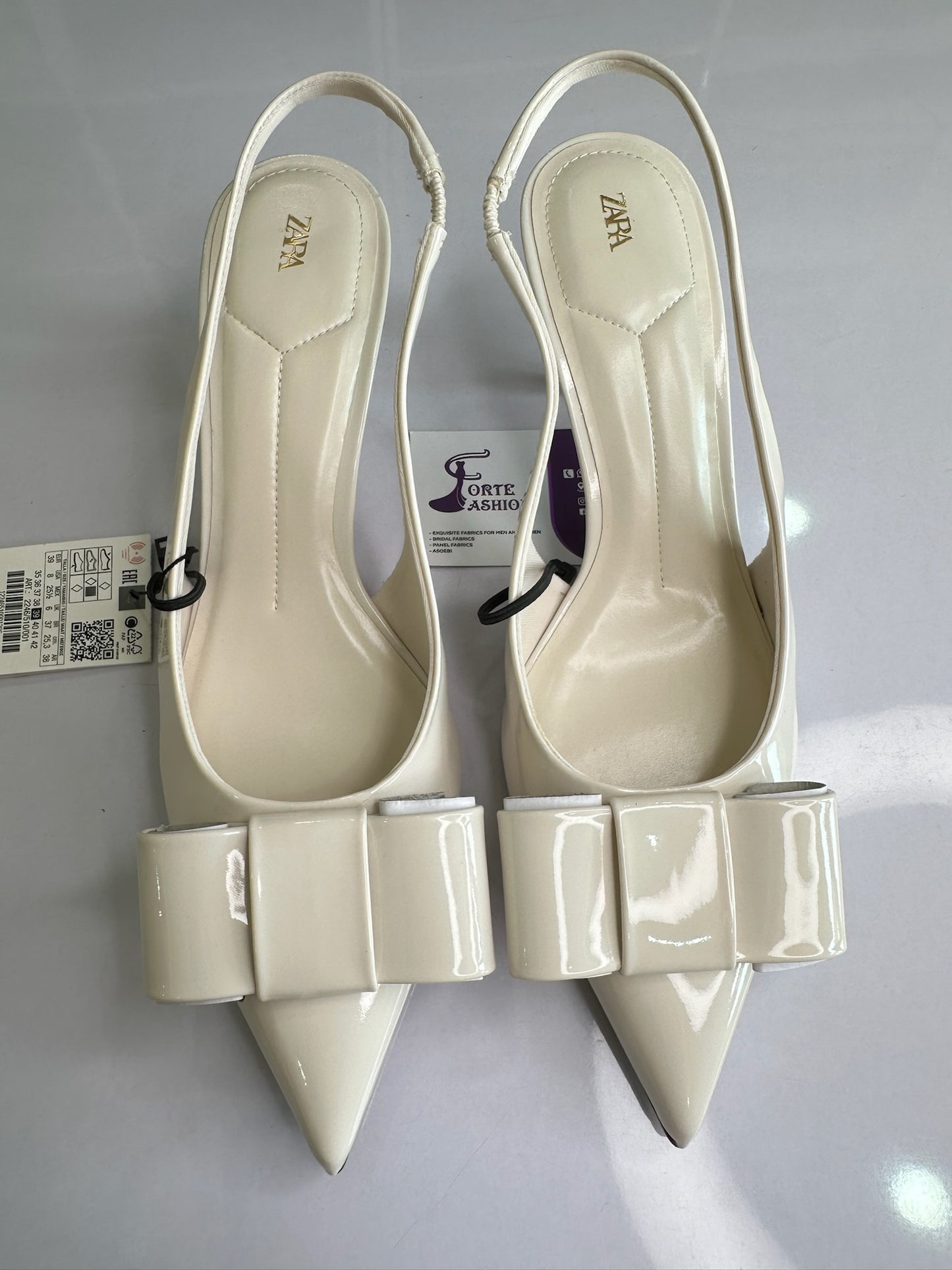 IVORY FAUX PATENT SLINGBACK HEELS WITH BOW