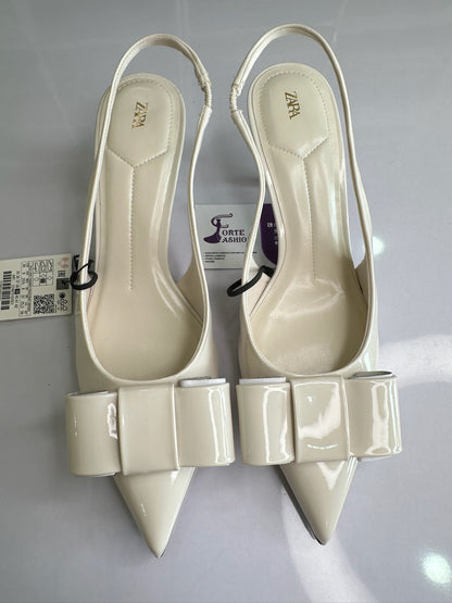 IVORY FAUX PATENT SLINGBACK HEELS WITH BOW