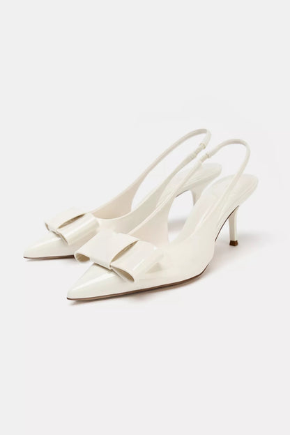 IVORY FAUX PATENT SLINGBACK HEELS WITH BOW