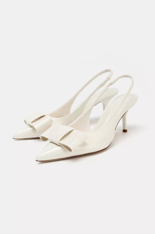 IVORY FAUX PATENT SLINGBACK HEELS WITH BOW
